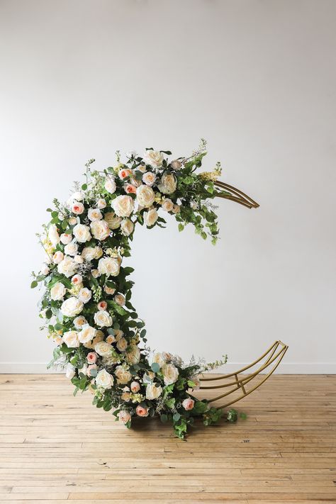 Fully decorated in florals, metal crescent-moon shaped arch backdrop. Diy Moon Arch, Moon Flower Arrangement, Crescent Moon Backdrop, Moon Wedding Arch, Moon Photoshoot, Moon Backdrop, Eid Decor, Floral Installations, Moon Wedding