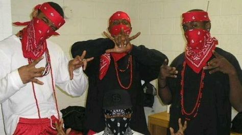 This is a picture of a popular gang in Los Angeles called "The Bloods". Davis argued that, "a great deal of sign conventionalization obtains in clothing as it does in the arts and crafts generally"(154). This gang exclusively wears the color red which differs from their rival gang who wears blue. If someone is seen wearing red in Los Angeles they are automatically associated with events that happen in gang life. C.K. Gang Color, Chicago Gangs, Cultura Hip Hop, Blood Wallpaper, Real Estate Websites, Gang Culture, Estilo Cholo, The Heist, Gangsta Style