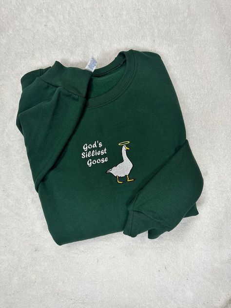 This Gender-Neutral Adult Sweatshirts item by JMACustomShop has 931 favorites from Etsy shoppers. Ships from New Castle, PA. Listed on Sep 15, 2024 Gods Silliest Goose, Funny Crewneck Sweatshirt, Machine Embroidered Clothes, Crew Neck Embroidery Ideas, Silly Embroidery, Hand Embroidery Sweatshirt, Duck With Knife, Duck Game, Goose Sweatshirt