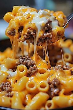 Indulge in the ultimate comfort food with this Cheesy Sloppy Cheeseburger Pasta recipe! A delightful fusion of your favorite cheeseburger and pasta, it's packed with ground beef, tomato sauce, and a gooey blend of cheeses. Top it off with classic cheeseburger fixings for the perfect hearty dish. Ready in just 30-45 minutes, it's a crowd-pleaser for families and busy weeknights. Try it today for a mouthwatering meal that everyone will love! 🧀🍝🍔 #CheeseburgerPasta #ComfortFood #FamilyRecipes Cheesy Sloppy Joe Pasta, Ground Beef Recipes With Pasta, Classic Cheeseburger, Beef Macaroni, Beef Tomato, Cheeseburger Pasta, Bowl Food, Comfort Dishes, Mouth Watering Food