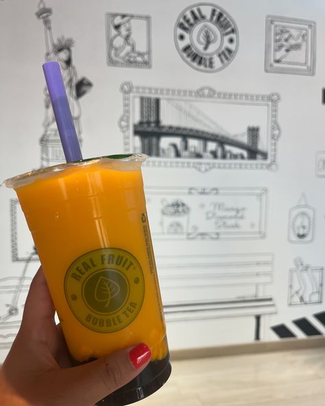 A vibrant Mango Diamond Slush from Real Fruit Bubble Tea, featuring a bright yellow slush topped with boba pearls and a fresh mango slice, served in a clear cup against a colorful background." Fruit Bubble Tea, Boba Pearls, Real Fruit, Tea Lovers, Summer Treats, Instagram Worthy, Sweet Taste, Beat The Heat, Bubble Tea