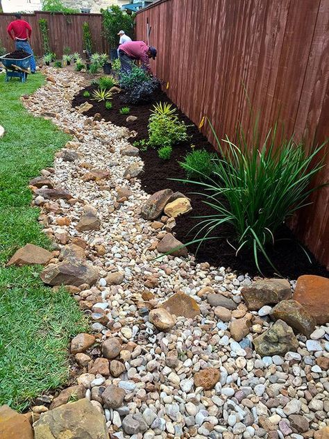 38 Striking Rain Garden Landscaping Ideas Color Rocks Landscaping, Backyard Dry Creek Landscaping, Dry Creek Garden, Rock Garden Against House, Dry Creekbed Garden, Plants With Rocks Around, Rock Garden Side Of House, River Rock Backyard Landscaping, Rock And Grass Landscaping Front Yards