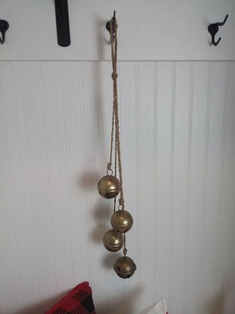 I recently saw an ad for a String Of Bells that cost over $40. Years ago I thrifted a few brass bells and never knew what to do with them. When I saw the ad, I knew I could recreate the same look with supplies I already had on hand. In this post I'm going to show you how to create your own string of bells. If you want to take it a step further, but don't know how to tie fancy knots like me, I'm also going to show you how to replicate the look using glue. For this DIY you will need ju… Fancy Knots, Jingle Bell Crafts, Xmas Bells, Christmas Door Hangings, Craft Bells, Decorative Knots, Front Door Christmas Decorations, Holiday Crafts Diy, Bell Decorations