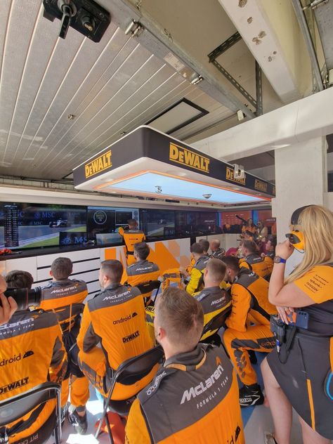 Mclaren Garage F1, Female F1 Driver Aesthetic Mclaren, F1 Pr Manager Aesthetic, Working In F1 Aesthetic, Mclaren Headquarters, Mclaren Garage, F1 Garage, F1 Girl, F1 Aesthetic