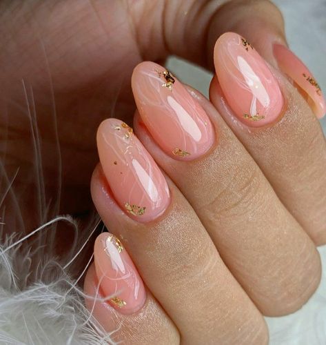 Almond shaped nails. Jelly pink nails, salmon pink nails, light pink nails, peach color nails, jelly pink nails with golden flakes, nails with golden flakes, almond nails with gold flakes, almond pink nails with golden flakes, almond pink nails, glossy nails Pink Nails Gold Flakes, Golden Flakes Nails, Pink Glossy Nails, Jelly Pink Nails, Almond Nails Pink, Glossy Nails, Peach Nails, Quartz Nail, Almond Shape Nails