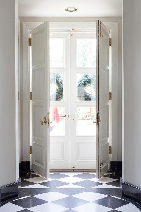 White Double Doors Exterior Entrance, Narrow Double Doors Entrance, Gray Quartz Countertops, Black And White Flooring, Company Photography, Double Door Entryway, Double Door Entrance, White Beadboard, White Laundry Rooms