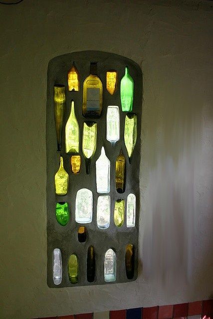 That is so cool! A wine bottle stained glass window. Will have to ask the glass people in my life about this-wonder if you could just make a panel to stand in the yard to catch the sun's rays? Ideas Recicladas, Bottle Window, Earthship Home, Bottle Wall, Cob House, Natural Building, Earthship, Backyard Fences, Wine Bottle Crafts