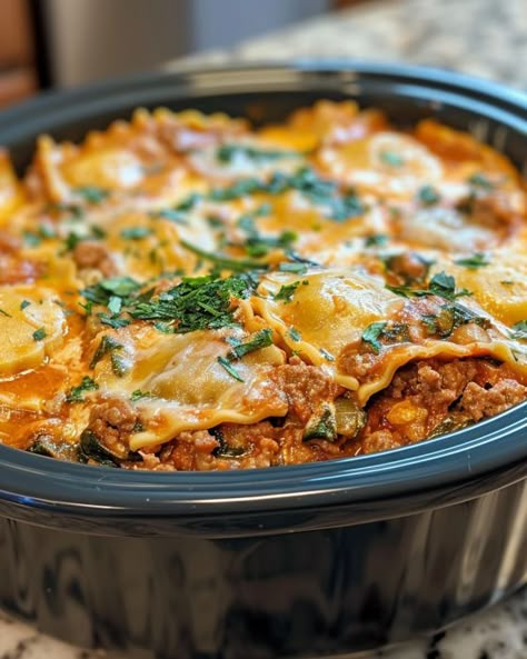 Tried it twice and it rocked both times! Can't wait to do it again. Cheese Ravioli Lasagna, Slow Cooker Ravioli Lasagna, Slow Cooker Ravioli, Slow Cooker Kitchen, Ravioli Lasagna, Cheese Ravioli, Potluck Dishes, Homemade Dinner, Crockpot Recipes Slow Cooker