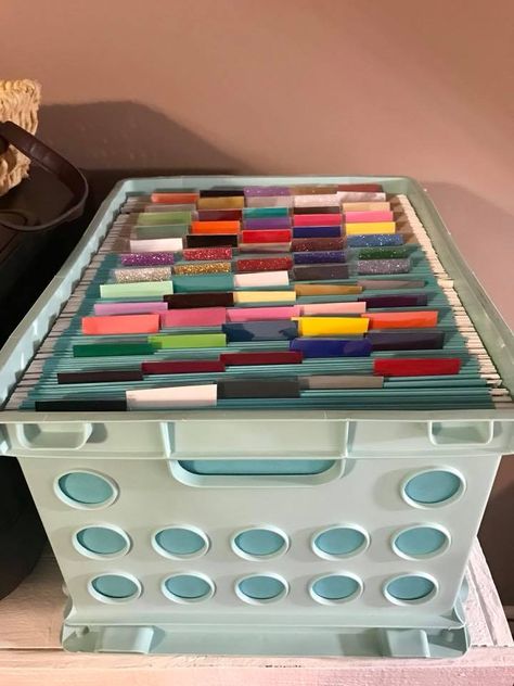 Cricut - Easy, organized way to store your vinyl scraps. Hanging file folders!  Turquoise folders hold htv scraps and gray hold adhesive scraps. Cricut 12x12 Vinyl Storage, Cricut Station, Vinyl Organization, Cricut Organization, Cricut Office, Cricut Storage, Cricut Supplies, Craft Station, Hanging File Folders