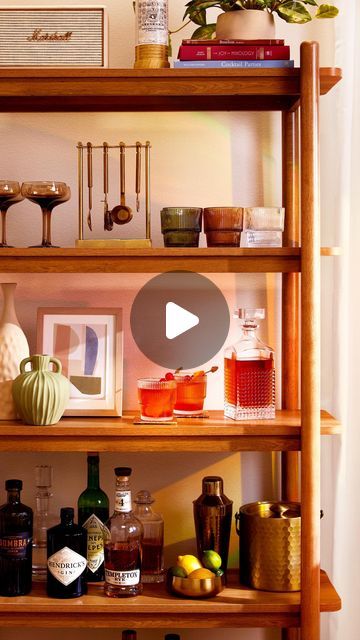 Better Homes & Gardens on Instagram: "Revamp your stale bar cart into a bar bookshelf! Bonus: this trend is actually a timeless take, plus you shouldn’t have to buy anything extra!  Use 1-2 rows on any old bookshelf you already have, and rework it to include your beautiful spirits and more funky, intricate glassware 🤎🥃📖" Bar Bookshelf, Bookshelf Bar, Old Bookshelf, Old Bookshelves, A Bar, Better Homes And Gardens, Your Beautiful, Better Homes, Bar Cart