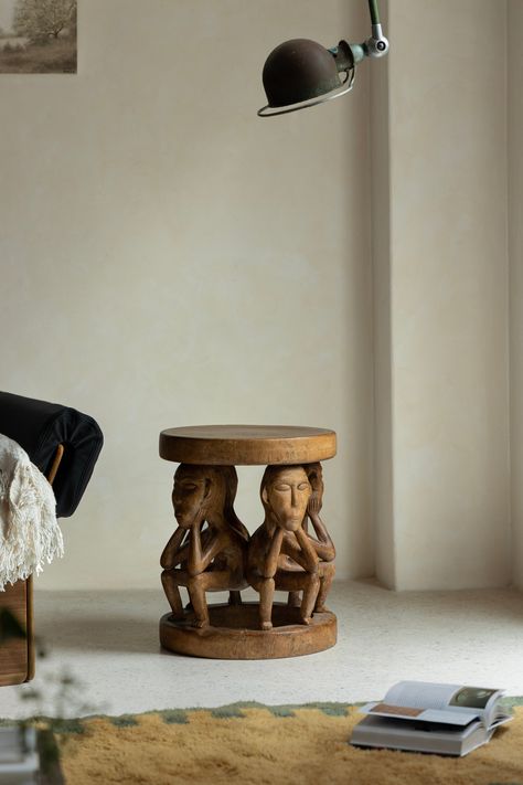 Enhance your living space with this exquisite African Tribal Sculptural Stool, a masterpiece of traditional craftsmanship. Hand-carved from premium wood, this stool features intricate designs of seated tribal figures, reflecting the rich cultural heritage of African art. Perfect as a functional piece or a decorative accent, it adds a touch of authenticity and elegance to any room. Ideal for living rooms, bedrooms, or entryways, this unique stool is a conversation starter and a testament to the b African Product Design, African Modern Home Decor, Furniture Photography Ideas, African Room Decor, Unique House Decor, African Stool, African Bedroom, African Room, African Wood Carvings