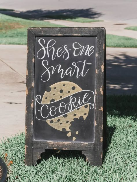 Hand lettered chalkboard sign - it’s a One Smart Cookie Graduation Party Ideas from Mint Event Design www.minteventdesign.com Vintage style Cookie Bar Graduation Party Ideas from Mint Event Design - party planner in Austin Texas www.minteventdesign.com #graduationparty #graduationpartyideas #partyideas #rusticpartyideas #partyinspiration #chalkboardsigns One Smart Cookie Graduation Party, Smart Cookie Graduation Party, Cookie Graduation Party, Graduation Activities, Vintage Milk Bottles, Graduation Party Planning, Graduation Party Themes, Graduation Party Ideas, One Smart Cookie