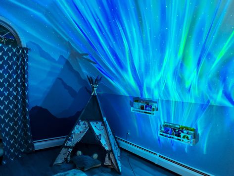 Northern lights projector on a mountain mural Northern Lights Baby Room, Northern Lights Nursery Theme, Northern Lights Mural, Northern Lights Nursery, Boys Woodland Nursery, Adventure Nursery Theme, Woodland Adventure Nursery, Northern Lights Decorations, Baby Boys Nursery