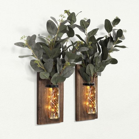 PRICES MAY VARY. RUSTIC WOOD FARMHOUSE WALL DECOR: The package includes 2 pack wood wall glass vases and 2 string lights. Our wall-hanging wood wall planter is thoughtfully designed to be both functional and visually appealing. The floating design gives it a natural and rustic look, allowing it to blend seamlessly into any room wall decor. They are perfect for a space that needs to be topped off with some gorgeous simplicity, like wood tones and greenery! ROMANTIC ATMOSPHERE: From rustic and chi Hanging Lanterns Living Room, Small Apartment Wall Decor, Wall Hanging Lanterns, Farmhouse Sconces, Cottage Core Wall Decor, Farmhouse Wall Decor Living Room, Wall Sconces Farmhouse, Greenery Wall Decor, Glass Wall Vase