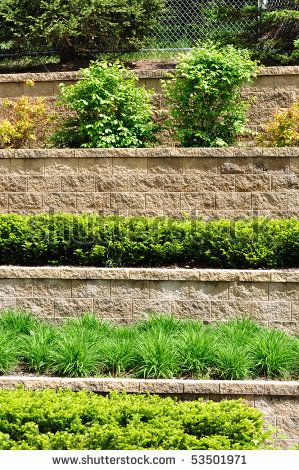 two tier retaining wall front yard - Google Search Auburn Tattoo, Tiered Retaining Wall, Building A Retaining Wall, Garden Retaining Wall, Sloped Backyard, Stone Retaining Wall, Landscaping Retaining Walls, Tiered Garden, Meteor Garden 2018