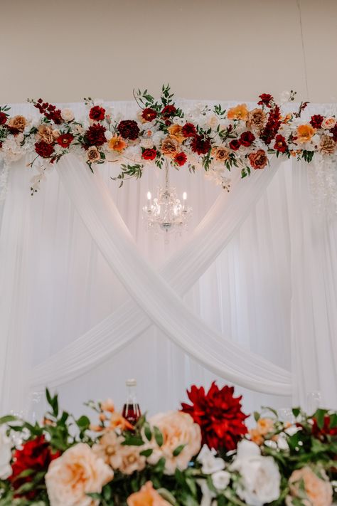 Stunning wedding curtain design for the stage of the recpetion with burgundy and peach florals with a chandiler Burgundy And Peach Wedding, Maroon Decor, Curtains Design, Ladies Tea, Altar Flowers, India Wedding, Reception Design, Engagement Decorations, Coral Flowers