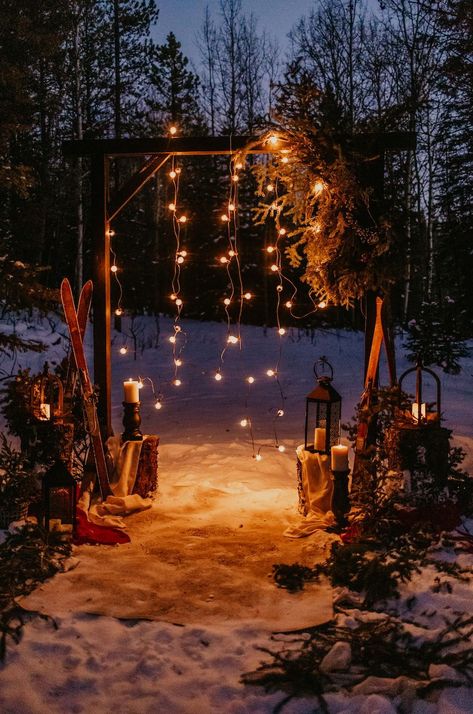 Twinkling fairy lights dance among evergreen foliage, casting a spell of romance and celebration. From cozy blankets to glistening snowflakes, step into a winter wonderland of love and enchantment with this breathtaking wedding decor! ❄✨💙 #winterweddingdecor #weddingdecorinspo #winterwedding Winter Wonderland Garden, Yule Themed Wedding, Winter Wonderland Proposal, Small Cozy Wedding, Budget Winter Wedding, Winter Woods Wedding, Cozy Winter Wedding Aesthetic, Small Christmas Wedding, Cozy Wedding Aesthetic