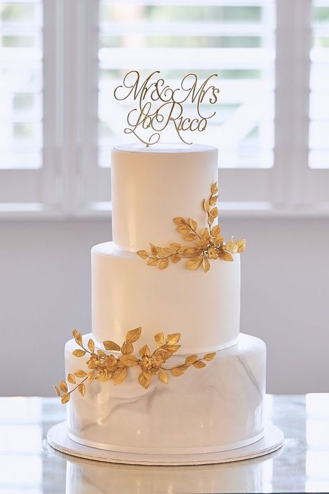 Elegant White And Gold Cake, Wedding Cake Ideas Elegant Gold, White And Gold Wedding Cake Simple, 2 Tier Wedding Cakes Simple Elegant Gold, Champagne Gold Wedding Cake, Gold Flake Wedding Cake, Wedding Cakes White And Gold, White And Gold Cake Wedding, Gold Wedding Cake Designs