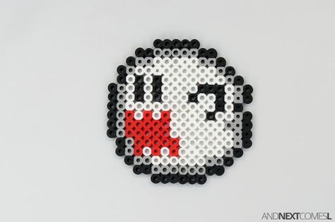 Super Mario World ghost boo perler bead craft from And Next Comes L Nintendo Switch Perler Bead Patterns, King Boo Perler Beads, Boo Perler Beads, Nintendo Perler Bead Patterns, Perler Bead Ghost, Super Mario Perler Bead Patterns, Mario Printables, Horror Perler, Alt Crafts