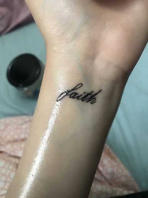 Tattoo Faith Symbol, Faith In Cursive Tattoo, Faith Tattoo Hand, Walk By Faith Tattoo Arm, Faith Wrist Tattoos For Women, Small Tattoos For Women On Wrist, Faith Tattoo Wrist, Tattoos For Guys Wrist, Wrist Small Tattoo