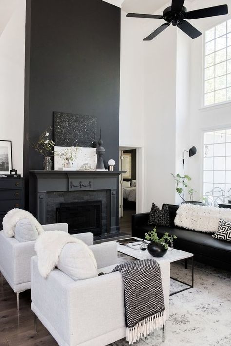 a Nordic living room with a black fireplace, black and white furniture, a black fan and a white coffee table Black And White Living Room Decor, Modern White Living Room, Georgia House, My Scandinavian Home, White Living Room Decor, Black And White Living Room, Black Fireplace, Nordic Living Room, White Living