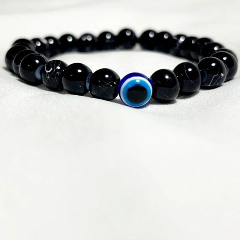 Shield Yourself with Our Evil Eye Bracelet!!! ✨👁️ Elevate your style and stay protected with our Evil Eye Bracelet! 💫 This chic accessory not only enhances your look but also offers a powerful shield against negativity. Made with care and designed for everyday wear or special occasions. Stay stylish and safeguarded! 🌟 📱DM for further details... #EvilEyeJewelry #FashionWithPurpose #ProtectiveCharm #ElegantBracelet #PositiveVibes #stylishprotection Protective Charms, Silver Pearl Bracelet, Elegant Bracelet, Eye Bracelet, Evil Eye Bracelet, Evil Eye Jewelry, Chic Accessories, Gaming Gifts, Silver Pearls