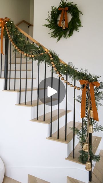 Kasey Dixon on Instagram: "HOLIDAY \ Christmas staircase styling!✨ Layering all the garland, gold beads and mini lights with velvet bows and bells!🔔🔔 SO many great finds from Target and Amazon in this setup! Happy decorating! Here are 3 easy ways to SHOP👇🏻 1. Comment “shop” to get links sent directly to your DMs 2. Click the link in my bio @sbkliving and select “shop my reels” 3. Head over to my @shop.ltk shop and follow me “sbkliving” #holidaydecorating #christmasdecor #christmasdecorating #christmasstyling #christmasgarland #amazonhome #christmasdecoration #targethome" Outdoor Stair Railing Christmas Decor, Garland With Bows Christmas, Decorating A Bannister For Christmas, Bannister Decorations Christmas, Simple Christmas Staircase, Banister Ideas Christmas, Garland Stairs Christmas, Simple Banister Christmas Decor, Banister Decorations For Christmas