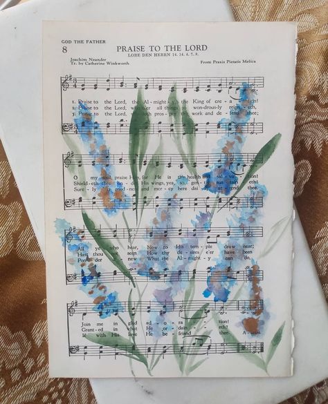 Kimberly Campbell on Instagram: “Happy Sunday! This is day whatever of the hymn art project. This is one of four going to a sweet mama. She wanted blues to match the…” Sheet Music Art Diy Craft Ideas, Art On Sheet Music, Hymn Art Diy, Watercolor Hymn Art, Bible Art Projects, Hymn Painting, Art Signature Ideas, Hymn Crafts, Christian Art Projects