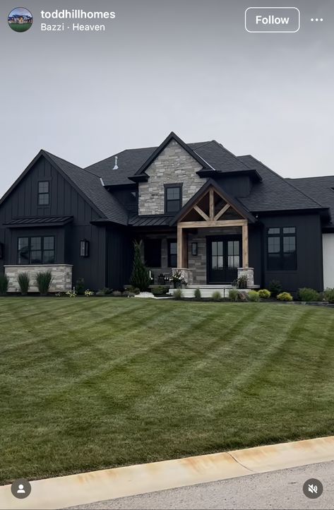 Black And Cedar House Exterior With Stone, Modern Dark Farmhouse Exterior, Black House Exterior Stone Accents, Modern Black House Design, Rural Home Exterior, Dark Home Exterior Brick, Brick And Dark Siding Exterior, Dark House With Stone, All Black House Exterior Modern