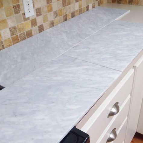 extra large marble tiles for a carrera marble countertop Diy Marble Countertops, Countertop Tiles, Kitchen Counter Tile, Kitchen Tile Diy, Marble Tile Kitchen, Granite Tile Countertops, Tile Countertops Kitchen, Copper Light Fixture, Replacing Kitchen Countertops