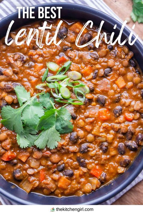 image of lentil chili garnished with cilantro and green onion in black bowl. Top text overlay: The Best Lentil Chilli. Bottom brand overlay: thekitchengirl.com with colored logo Lentil Chili Recipe Crockpot, Black Bean And Lentil Chili, Slow Cooker Lentil Chili, Lentils In Pressure Cooker, Lentil Taco Chili, Chili Lentil Recipe, Easy Lentil Chili Recipe, Slow Cooker Lentils Recipe, Chicken Lentil Chili