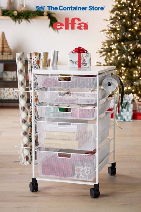 Available only at The Container Store, our exclusive Get ready for holiday wrapping! The Elfa Mesh Gift Wrap Cart is a mobile gift packaging organizer for wrap, totes, tissue, ribbon and accessories. It includes three 1-Runner Mesh Drawers and two 2-Runner Mesh Drawers. The fine weave of the mesh prevents small items from falling through. Clipped to the exterior is a Ribbon Dispenser, Gift Wrap Organizer and Accessory Basket. Gift Wrapping Cart, Gift Wrap Cart, Wrapping Cart, Ribbon Dispenser, Mesh Drawers, Gift Wrap Organizer, Gift Wrap Organization, Kitchen Drawer Organizers, Closet Systems