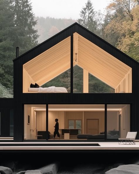 Nestled along the riverbank in the Black Forest, Germany, this minimalistic concept home boasts a sleek design that combines modern living with the serenity of nature. Imagine cozy evenings by the fire, surrounded by the calming sounds of the forest. 🌲🏡 Follow @houseilo for more stunning sustainable homes and eco-friendly design inspiration. #modernarchitecture #minimalisthome #blackforestgermany #sustainableliving #ecofriendlyhomes #riversidecabin #greenbuilding #houseilo #naturedesign #s... Eco Lodge Architecture, Small House Concept, Lodge Architecture, Black House Design, Black Forest Germany, Camp House, Black Living, Forest Sounds, The Black Forest