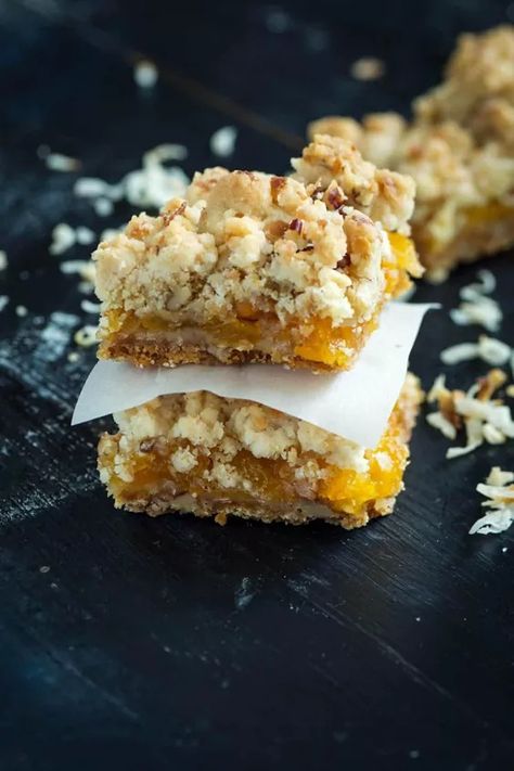 Apricot bars made with dried apricots have a buttery shortbread crust and topping. Pecans and coconut create a wonderful flavor when combined with the shortbread. You don’t have to wait for apricot season to enjoy sweet apricots.For more details and tips go to  Butter & Baggage      For these apricot shortbread bars, you’ll find that sweet apricot taste that comes from the fruit itself and not from a lot of added sugar like you get with most jams. What really pushes these shortbread bars… Apricot Bars Recipe, Summer Dessert Table, Apricot Bars, Apricot Recipes, Dum Dums, Buttery Shortbread, Shortbread Bars, Shortbread Crust, British Baking