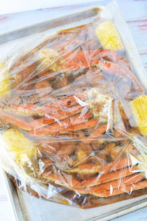 How to cook seafood in a bag in the oven! Crab boil in a Reynolds oven bag with corn, sausage and shrimp in 30 minutes tender with Old Bay. Seafood Boil Recipes Oven, Seafood In A Bag, Shrimp Boil In Oven, Crab Boil Recipe, Steamed Crab Legs, Cooking Crab Legs, Cooking Crab, Crab Legs Recipe, Oven Bag