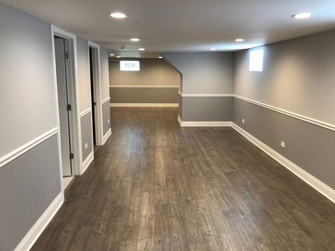 Great job on this finished basement. Two toned gray walls with the chair railing, can lighting, vinyl flooring, and white trim.  Two thumbs up! 👍👍#FinishedBasement . . . . #insidershowhomes #soldbykurtclements #chicagorealestate #chicagosouthside #southsidechicago #chicagosouthsuburbs #southsuburbschicago #chicagoland #realestatetips #realestateadvice #firsttimehomebuyer #sellyourhome #realestateforsale #realtor #realestateagent #openhouse #nardorealtor #homebuyertips #homesellertips #realesta Two Tone Grey Walls, Walls With Chair Rail, Grey Walls White Trim, Chair Railing, Two Tone Walls, Grey Walls Living Room, Gray Walls, Chair Rail, Basement Renovations