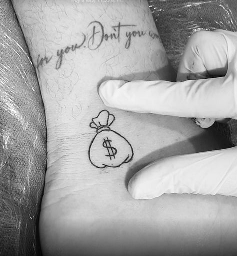 Cute Money Tattoo, Money Bag Finger Tattoo, Bag Of Money Tattoo, Money Heart Tattoo, Small Money Bag Tattoo, Money Tattoo Ideas For Women, Small Money Tattoo, Cash Tattoos, Money Bag Tattoo Design