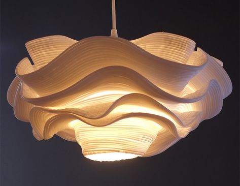 This unique pendant lamp may look like a fluffy cloud hanging down from the ceiling, but upon closer inspection is unexpectedly crafted from zippers. Design Objet, Ethereal Light, Unique Pendant Lights, Kitchen Lights, Metal Canopy, Wooden Lamp, Elegant Lighting, The Source, Lamp Shades