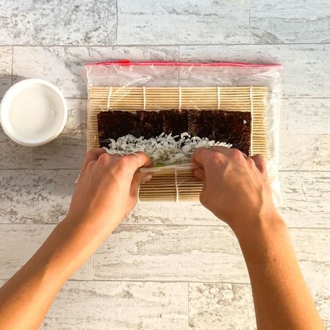 Learn how to roll sushi using our step by step photo & video guide. Instructions for through rolling sushi with or without a mat! How To Roll Sushi With Mat, How To Roll Sushi, Sushi Mat, Roll Sushi, Diy Sushi, How To Roll, Sushi Rice, Sushi Rolls, Hand Roll