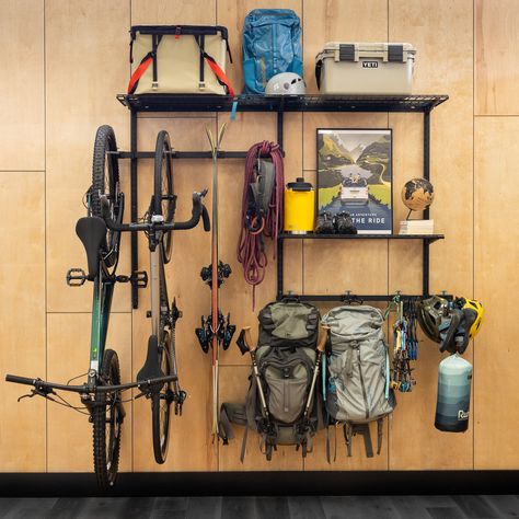 Customizable wall storage for bikes, skis, backpacks, bags, camping gear, and more! Bike Gear Storage Ideas, Ski Gear Storage, Ski Equipment Storage, Bike Gear Storage, Gear Room Organization, Outdoor Gear Storage, Wall Storage System, Snowboard Storage, Camping Gear Storage