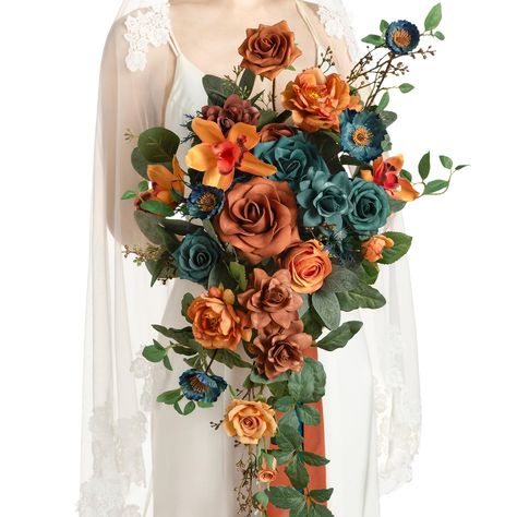 PRICES MAY VARY. Package: A 11" bridal bouquet with 2 ribbons wrapped on a card. Size: The bride bouquet is approx. 11" wide by 20" tall (includes sagging greenery), one burnt orange chiffon ribbon is 1.5" W x 5ft L, and one teal ribbon is 2" W x 5ft L. Material: Made of high-quality silk flowers and silk greenery. Silk flowers include french yellow tree peony, burnt orange cymbidium, peacock green anemone, and peacock green sea holly. Foam flowers include burnt orange avalanche rose, hazelnut g Teal Wedding Bouquet, Bridal Bouquet Cascading, Teal Bouquet, Bouquets For Wedding, Orange Wedding Bouquet, Cascading Wedding Bouquets, Burnt Orange Weddings, Bridal Bouquet Flowers, Artificial Flowers Wedding