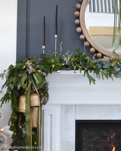 Bells On Mantle Christmas, Mantle Holiday Decorating Ideas, Mantle Christmas Garland Ideas, Christmas Mantel 2024, Christmas Mantle Decor With Bells, Fireplace With Garland, Christmas Mantle With Ribbon, Mantel Christmas, Mantle Christmas Garland