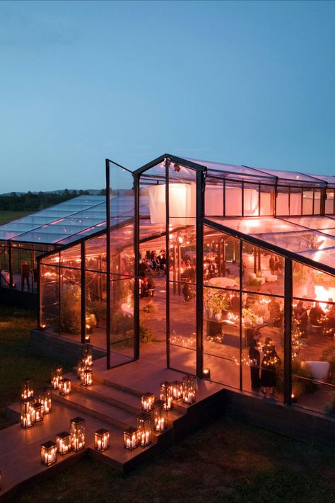 A breathtaking glasshouse reception set against the serene countryside. As the sun sets, candlelight reflects off the glass walls, casting a warm glow over the space. This venue offers a magical blend of natural beauty and modern design. Glasshouse Wedding, Glass House Wedding, Best Destination Wedding, Wedding Planning Services, Glass Walls, Best Wedding Planner, Tent Wedding, Sun Sets, Destination Wedding Planner