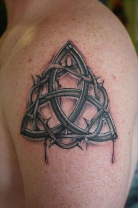 11 Irish Trinity Knot Tattoo Celtic Trinity Knot Tattoo, Trinity Knot Tattoo, Cross Tattoo Meaning, Celtic Tattoos For Men, Shoulder Armor Tattoo, Holy Trinity Tattoo, Trinity Tattoo, Small Wave Tattoo, Celtic Knot Tattoo