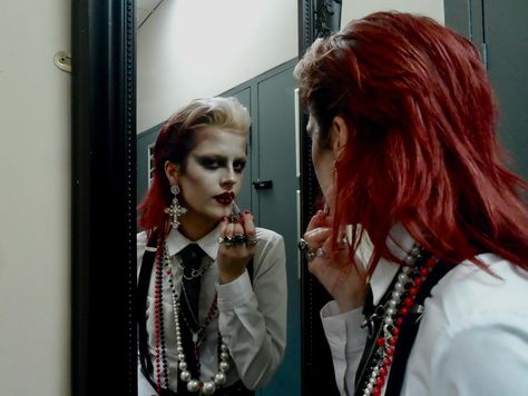 dressed to kill 📸 @gracevharper . . . . . . . . . . . #womeninsuits #blacktie #80sfashion red hair mullet wet look slicked back black tie white shirt alt alternative new wave new romantic androgynous androgyny punk goth gothic subculture 80s maximalist maximalism david bowie women in suits power suit suspenders braces chunky necklaces jewellery rings lipstick lip make up makeup mua editorial avant garde mirror pic photoshoot model modelling philosofay 80s Maximalism Fashion, Red Tie Outfit, Black Tie White Shirt, Red Hair Mullet, New Wave Outfits, 80s New Romantic, New Wave Makeup, Suit Suspenders, 80s Mullet