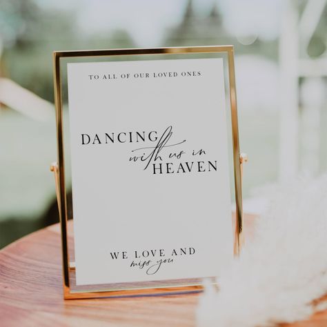 Remember your loved ones in a special way with our "Dancing With Us in Heaven" sign. This loving memory table sign is perfect for weddings, allowing you to honor those who are no longer with us but forever dancing in heaven. Our editable sign features a heartfelt message that will bring comfort and warmth to your celebration. Light a candle and let their presence be felt as you commemorate them with this beautiful in memory sign. Include this touching heaven wedding sign in your wedding signage Tribute To Lost Loved Ones At Wedding, In Loving Memory For Wedding, Including Lost Loved Ones In Wedding, Celebrating From Heaven Wedding Sign, Sign For Loved Ones In Heaven Wedding, Missing You Wedding Table, Loved Ones Sign Wedding, Heaven Signs For Wedding Memory Table, Remembrance Ideas For Wedding