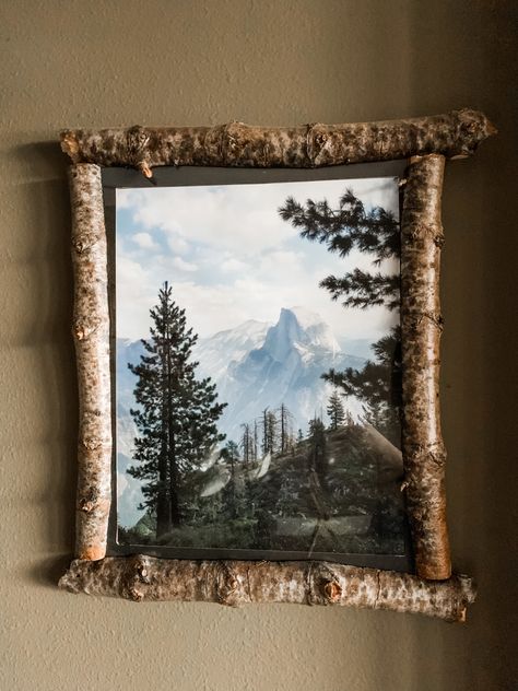 Make your own frame using nature around you! This frame used to be the hiking stick my husband and I found/used on this exact hike you see in the picture we took! He broke the stick, sawed the sticks in halves, applied a protective coating, connected all together, and added glass cover to protect picture. Such a special memory to have hanging on our wall! Recycled Frame Ideas, Unique Frames For Pictures, Home Made Picture Frames, Stick Frame Diy, Picture Frame Sticks, Rustic Wood Frames Diy, Rustic Frames Ideas, Stick Frame, Stick Picture Frame