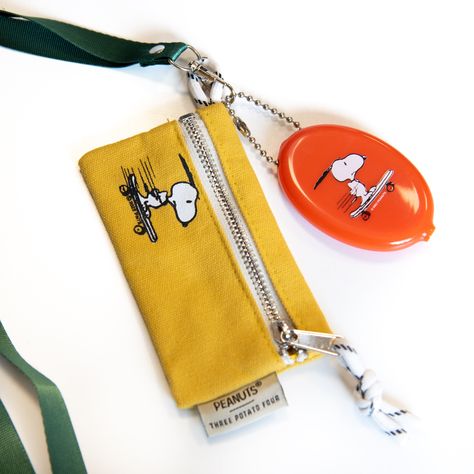 Classic mini zip pouch wallet with a loving touch of Snoopy nostalgia. Our zip pouches are made of durable, heavy duty canvas and made to keep all your little things safe and secure. Pouches feature optional lanyard attachment and easy open zipper pull and hanging loop.3" x 5"12 oz Durable Canvas Exterior + Nylon Cloth InteriorParacord Loop34" Lanyard Snoopy Wallet, Snoopy Skateboard, Orange Vinyl, Four X, Diy Sweatshirt, 카드 디자인, Felt Pennants, Cute Wallets, Summer Camps