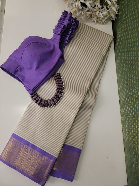 Beige and grey striped handwoven Kanchipuram silk saree with lilac Korvai border crafted in gold zari featuring intricate geometric patterns and Rudrakshams. The pallu is in lilac with paisleys, Mayil and geometric pattern in gold zari. This saree combines the opulence of Kanchipuram silk with Korvai border, making it a perfect choice for any traditional occasions. Blouse: Lilac Kanchipuram silk with zari motifs and Korvai border Unique Kanchipuram Silk Saree, Korvai Silk Sarees, Korvai Silk Sarees Kanchipuram, Grey Saree Blouse Combination, Lilac Silk Saree, Pattern Blouses For Sarees, Striped Blouse Designs, Saree Combination, Exclusive Saree Blouse Designs