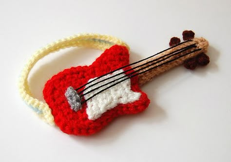 Amigurumi Guitar pattern for sale on Etsy https://www.etsy.com/listing/75185729/crochet-pattern-guitar?ref=sr_gallery_7&ga_search_query=Crochet+guitar+pattern&ga_order=most_relevant&ga_view_type=gallery&ga_ship_to=ZZ&ga_search_type=all Crochet Music, Guitar Patterns, Confection Au Crochet, Crochet Vintage, Knitting Bags, Haken Baby, Paintbox Yarn, Crochet Applique, Yarn Needle